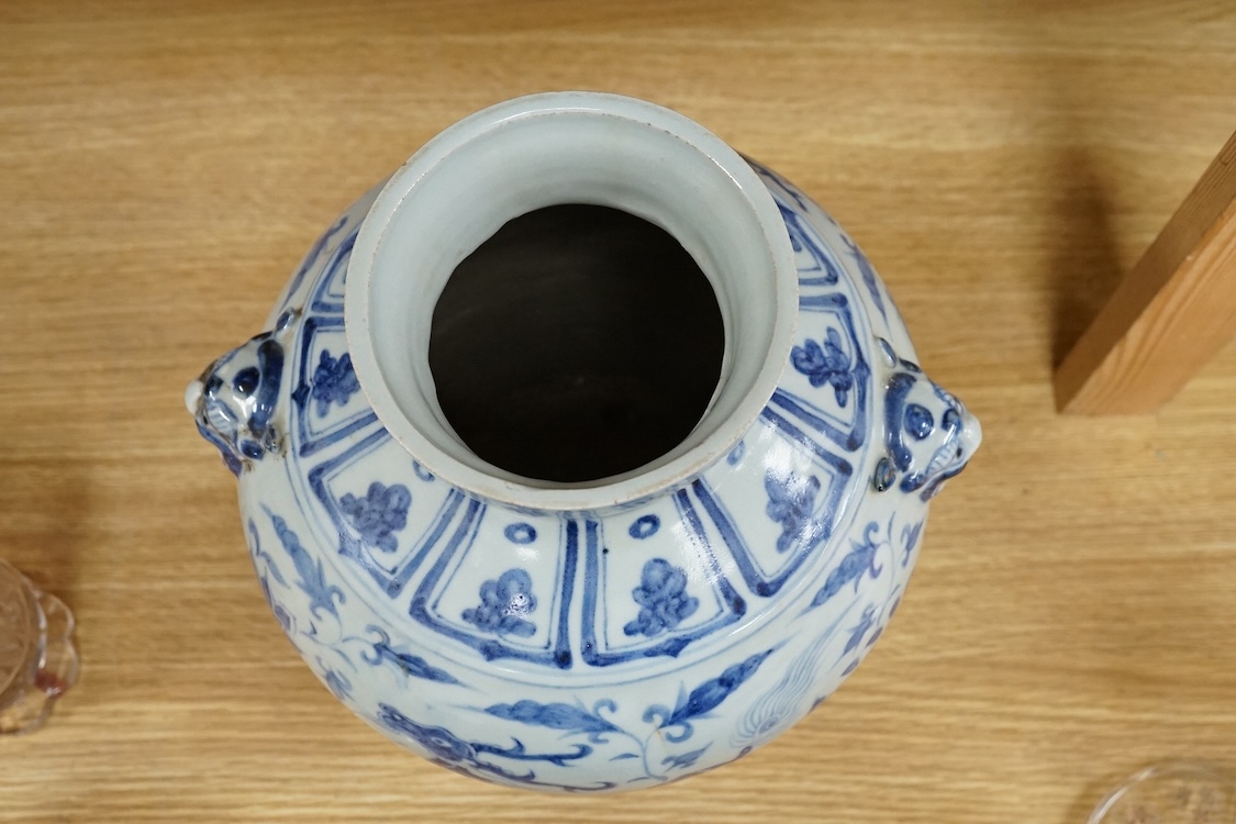 A Chinese blue and white bulbous jar hand painted with animals, 28cm high